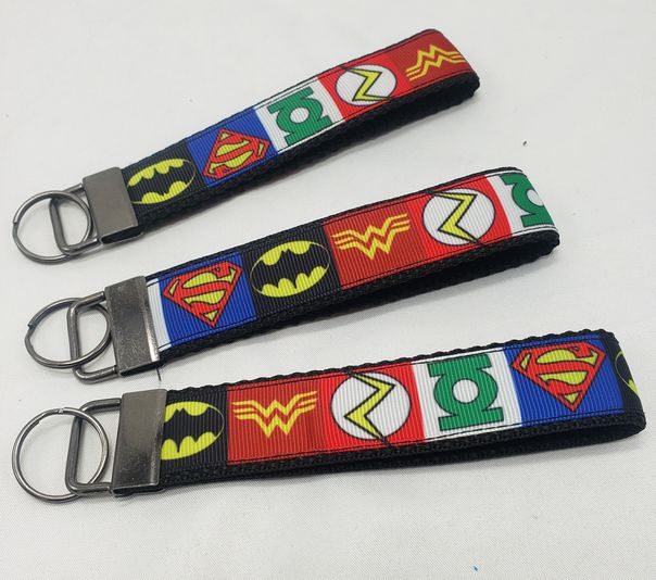 Load image into Gallery viewer, DC 5 in wristlet keychain
