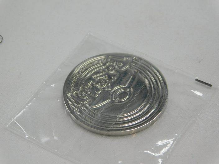 Load image into Gallery viewer, Metal Pikachu coin - Pokemon Celebrations - Pokemon Center
